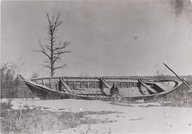 Métis assis sur le bord d'un bateau - Expédition H.Y. Hind à Red River,Manitoba 