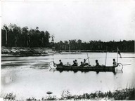 Hudsons Bay Company birch bark canoe on the Abitibi river. Canot de bouleau de la Compagnie de la Baie d'Hudson sur la rivière Abitibi