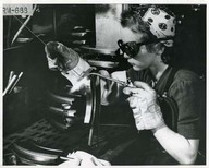 A girl welder at the Bren gun plant, John Inglis Co. Toronto, Ontario