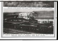 An immense krupp gun leaving the works at Essen on one of the great truck specially built to transport the heavy weapons.