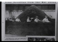 In the trenches -of tea ! A great mound of 48,000 pounds of tea which is being mixed and blended in London before being packed and shipped to British soldiers at the front.