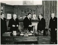His Excellency Viscount Alexander of Tunis, Governer General of Canada, is shown receiving bill relating to terms of union with Newfoundland for signature.
